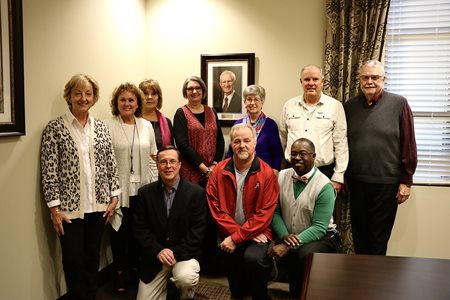 eCO board members pose with Dr. Pruden's family