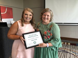 Scholarship recipient, Debra Welsh, smiles with eCO Credit Union Marketing Coordinator, Hope Finley.