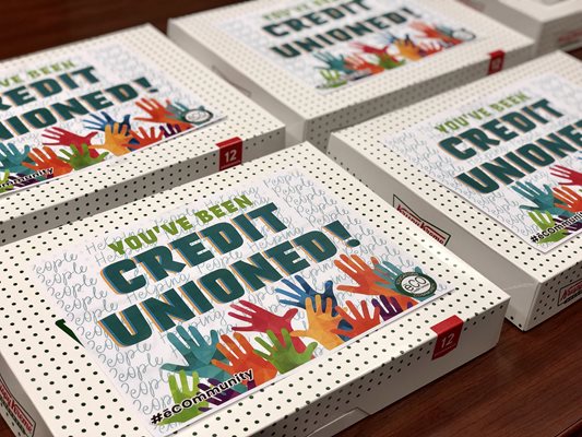 You've been Credit Unioned signs on doughnut boxes