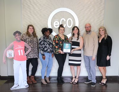 The top fundraising team poses with their certificate