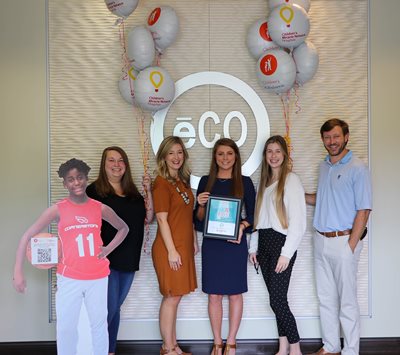 The third place fundraising team poses with their certificate.