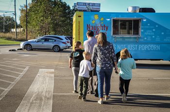 Members walk to the food truck.
